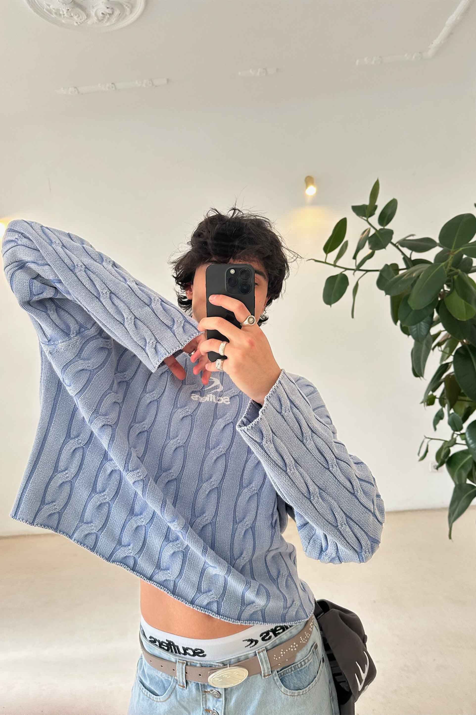 Nueva gabardina de punto azul